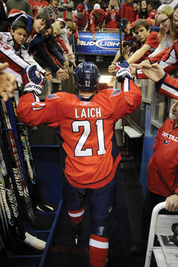 Capitals forward Brooks Laich walks through a throng of fans to get to his locker room.