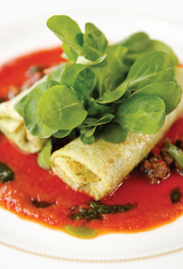 Evo Bistro’s lamb crepes reposed in a lake of slow-cooked tomatoes.
