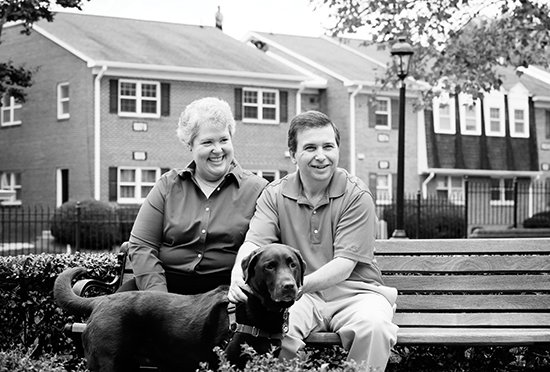 Karl Robb with his wife, Angela, and their chocolate Labrador, Lily.