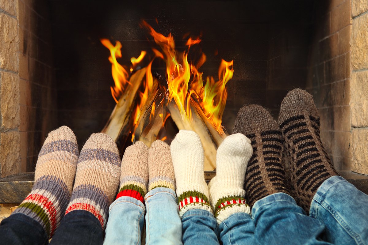 Feet warming near the fireplace