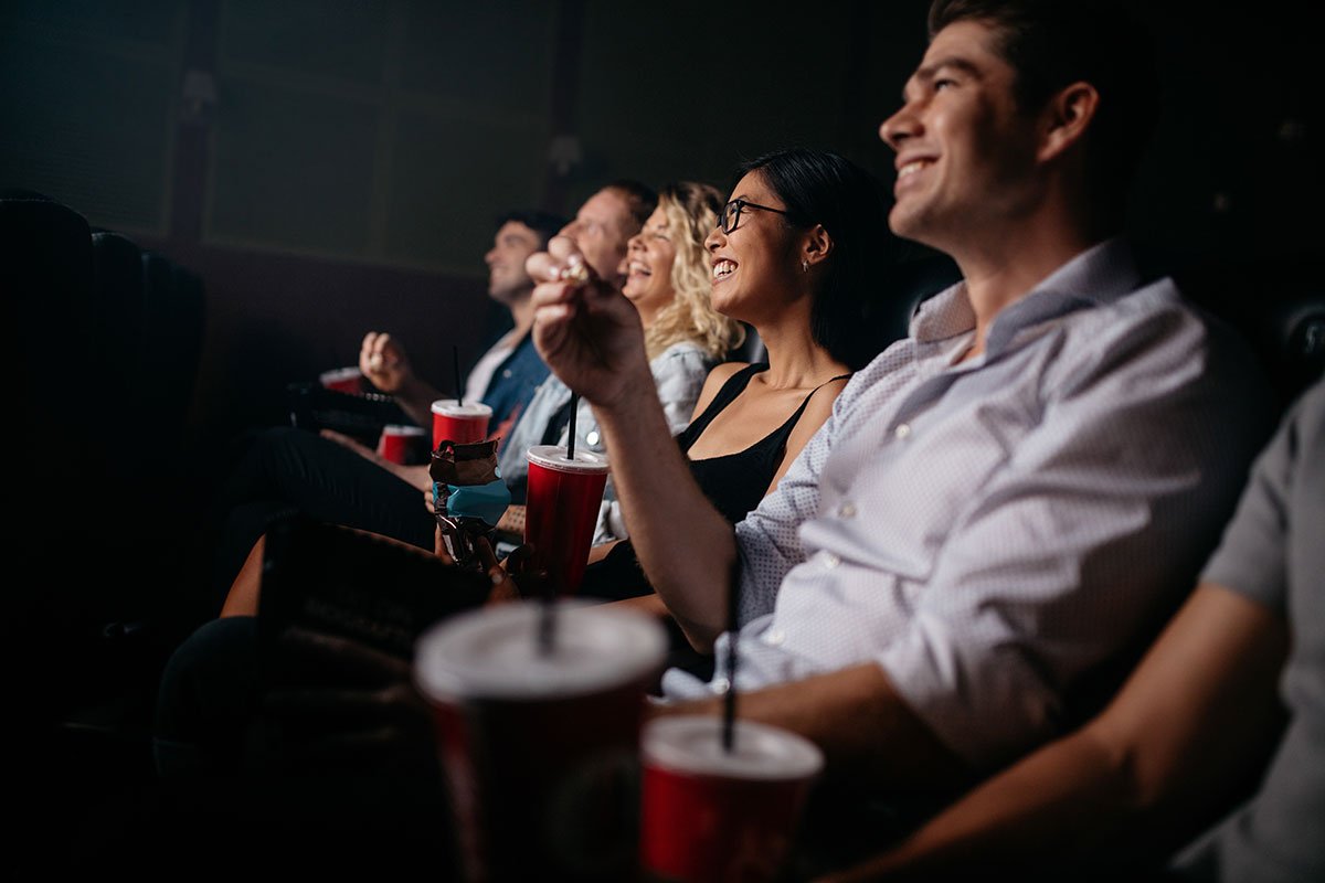 people-sitting-in-theater-happy