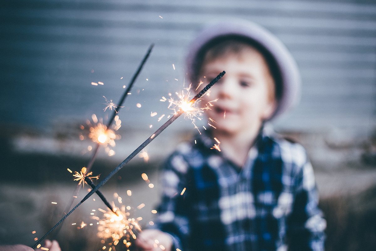 child holding sparkler