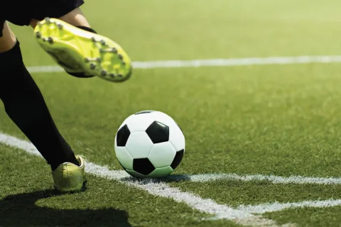 playing kicking soccer ball