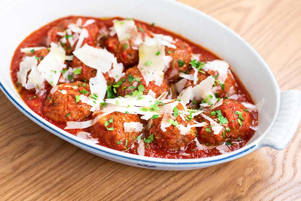 meatballs with cheese in white dish