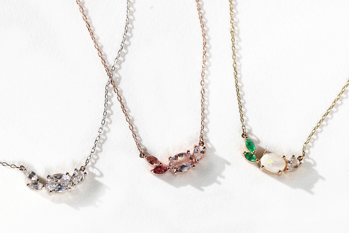 three necklaces with jewels