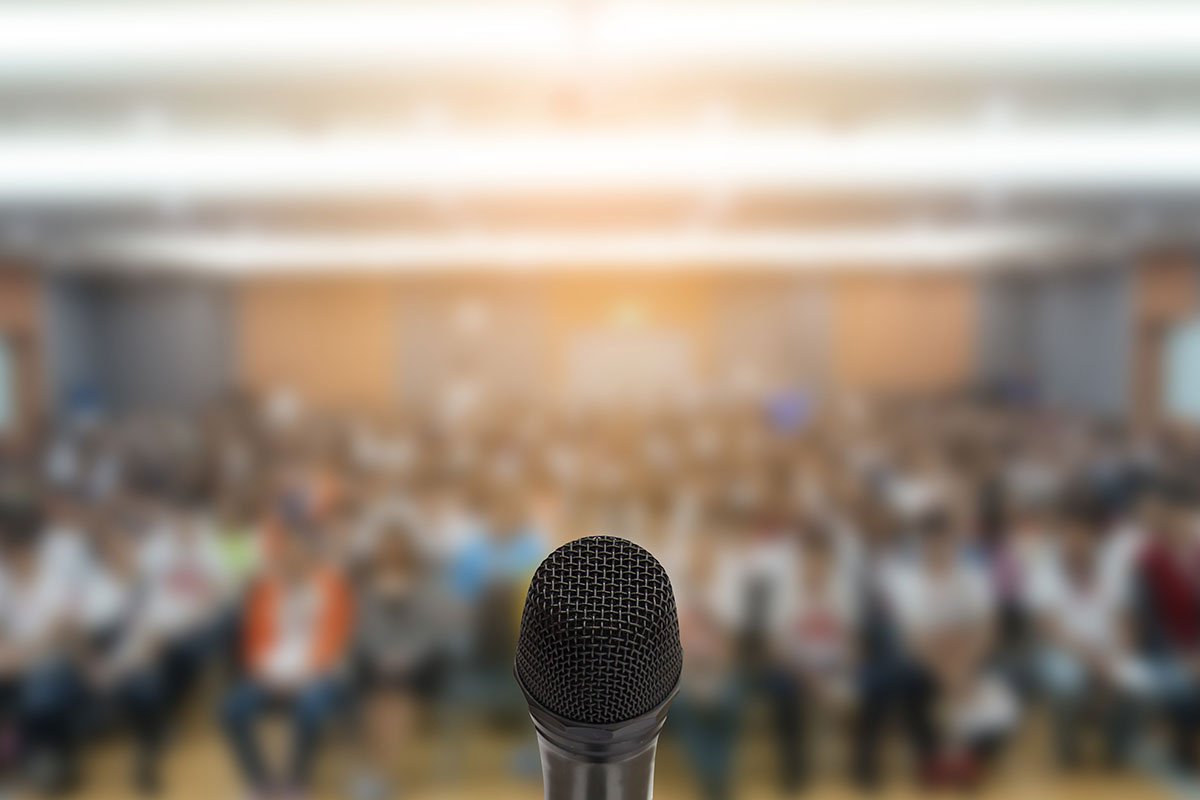 microphone with blurred crowd
