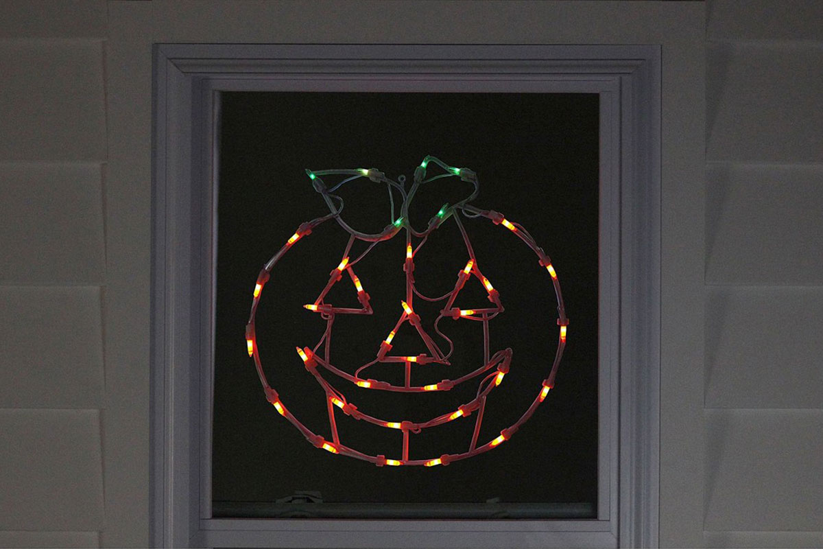 lit up window pumpkin