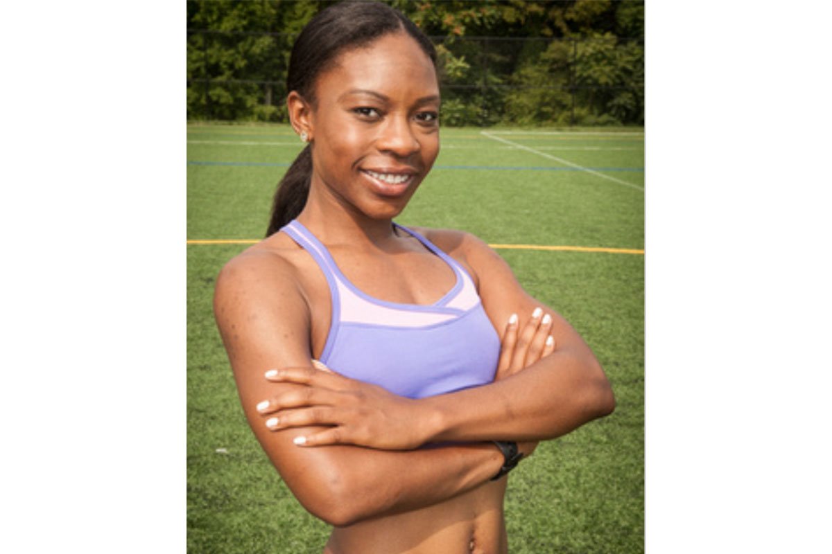 woman in sports bra with arms crossed