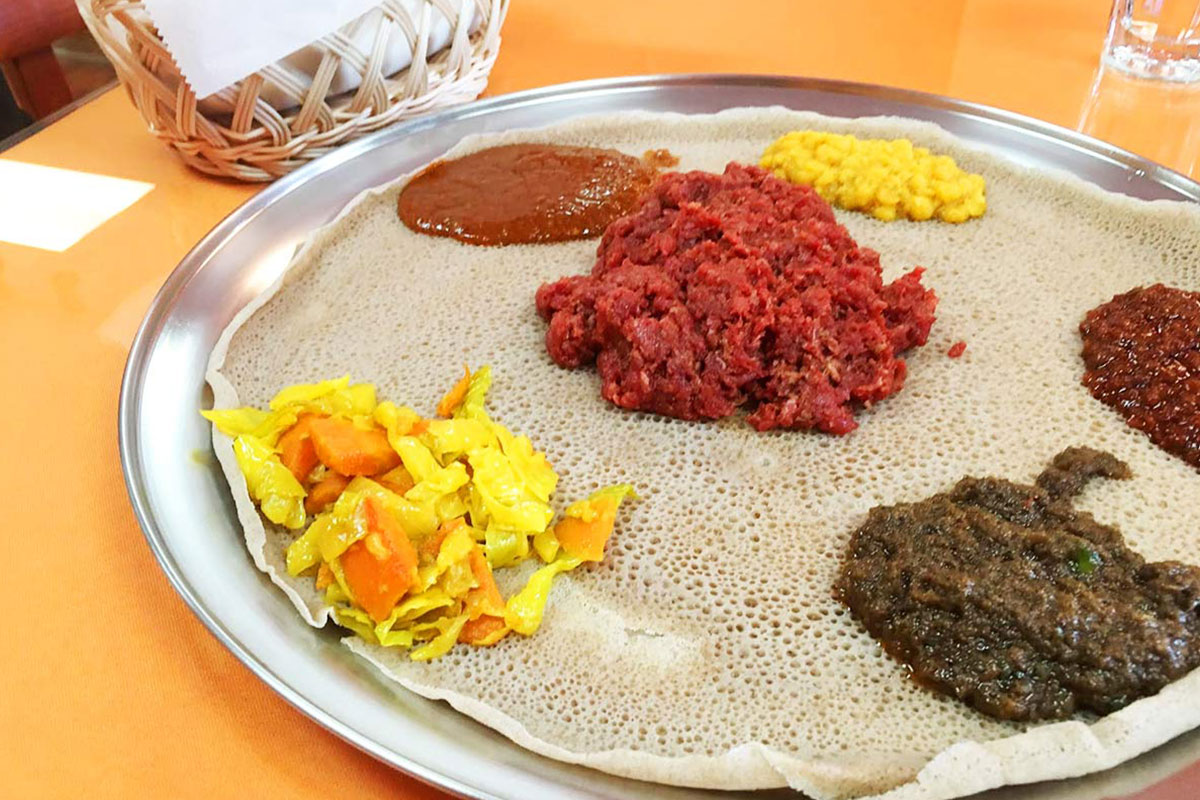 ethiopian food with various dips and sauces
