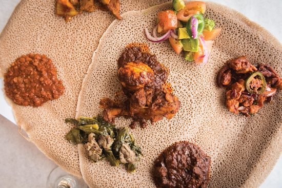ethiopian food on flatbread with sauces