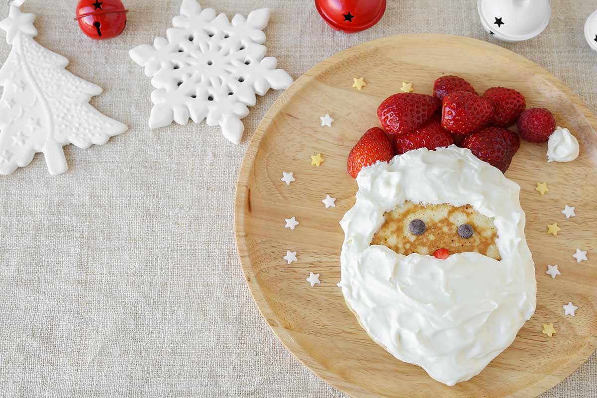 pancakes with strawberries and whipped cream that look like santa