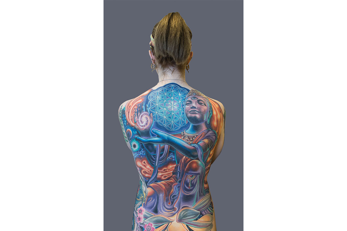 large colorful tattoo on girls back