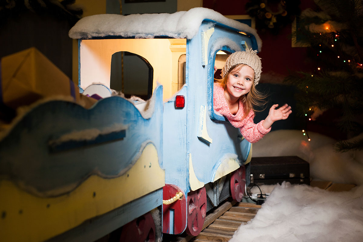 little girl on train holidays christmas
