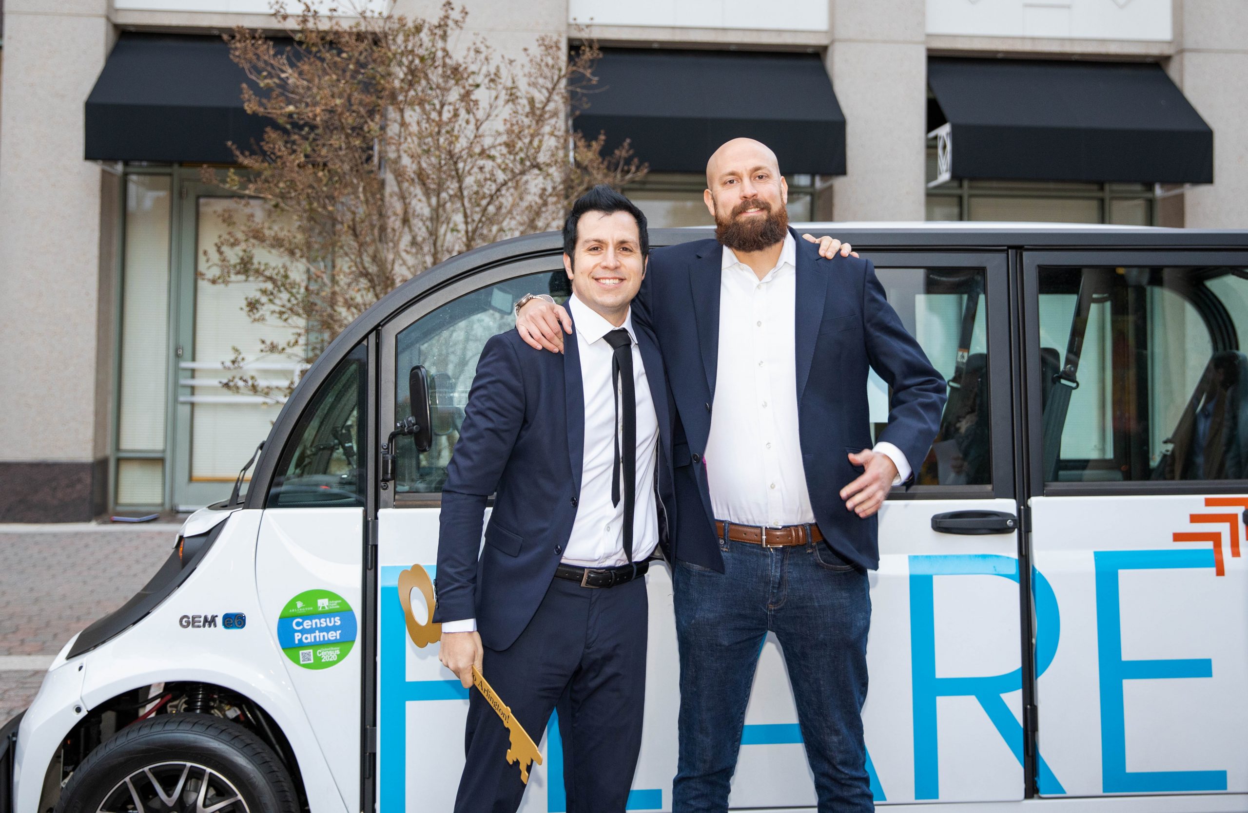 two men in suits in front of flare car