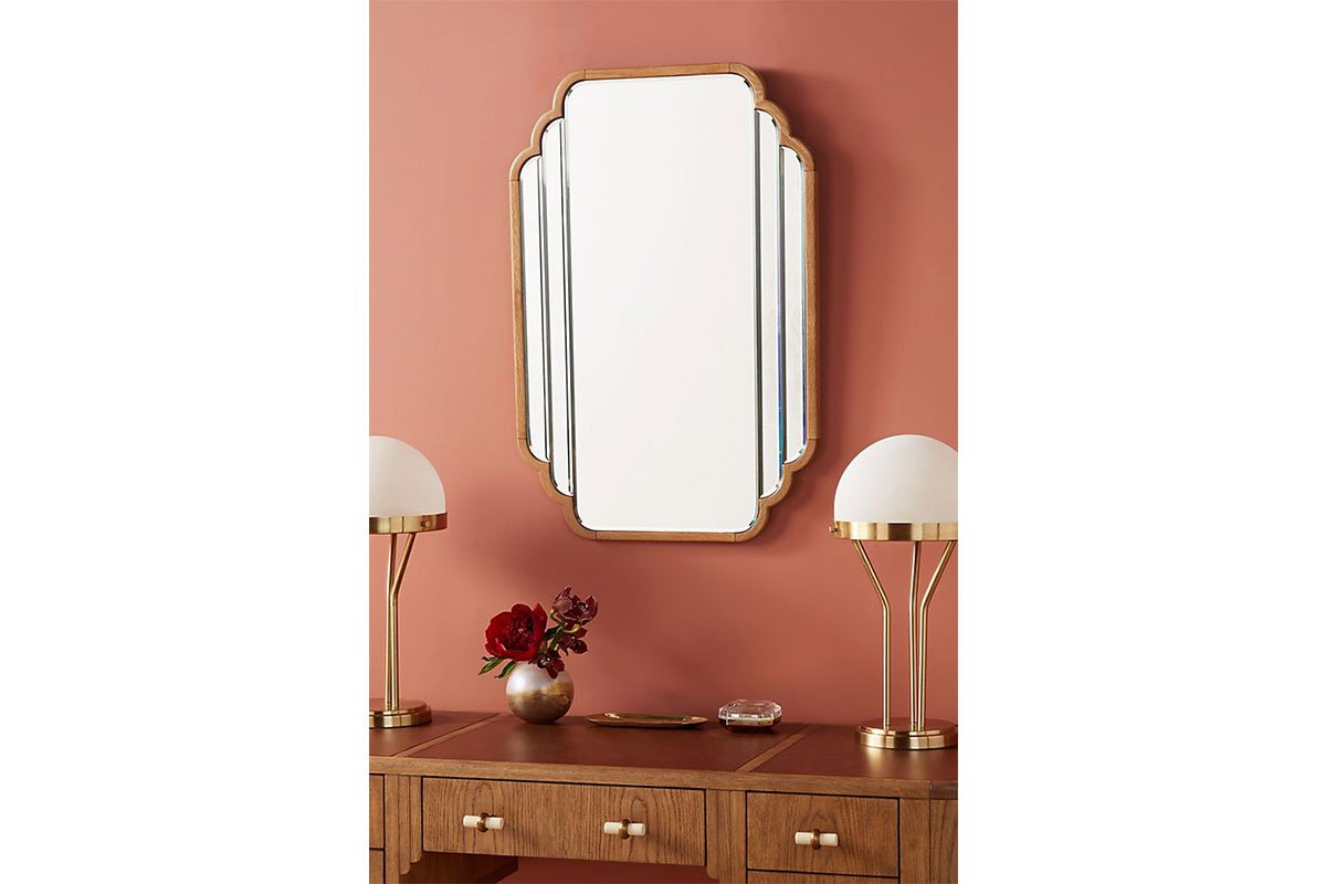 art deco mirror against orange wall