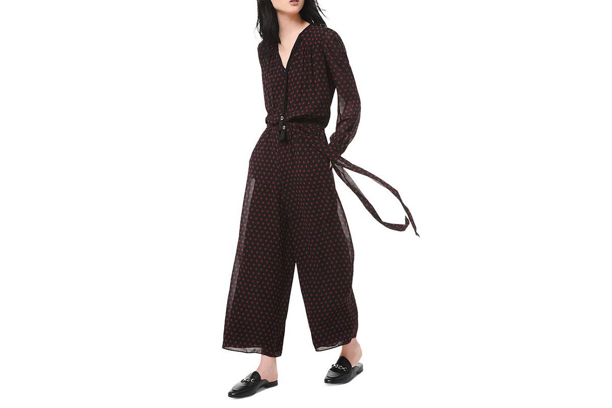 black jumpsuit with red polka dots