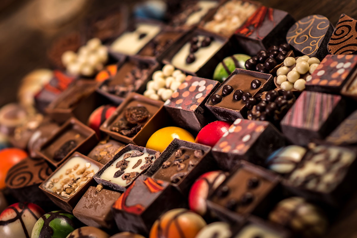 chocolates lined up with different colors and shapes
