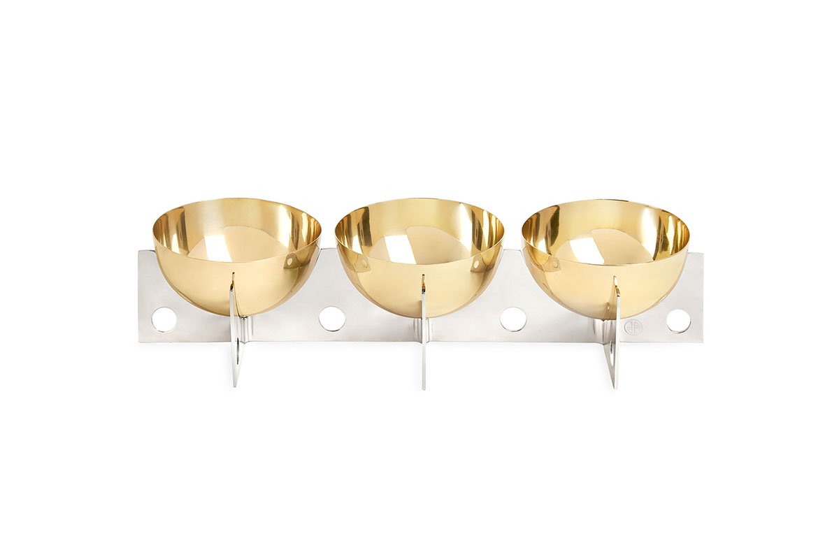 gold bowls on white stand