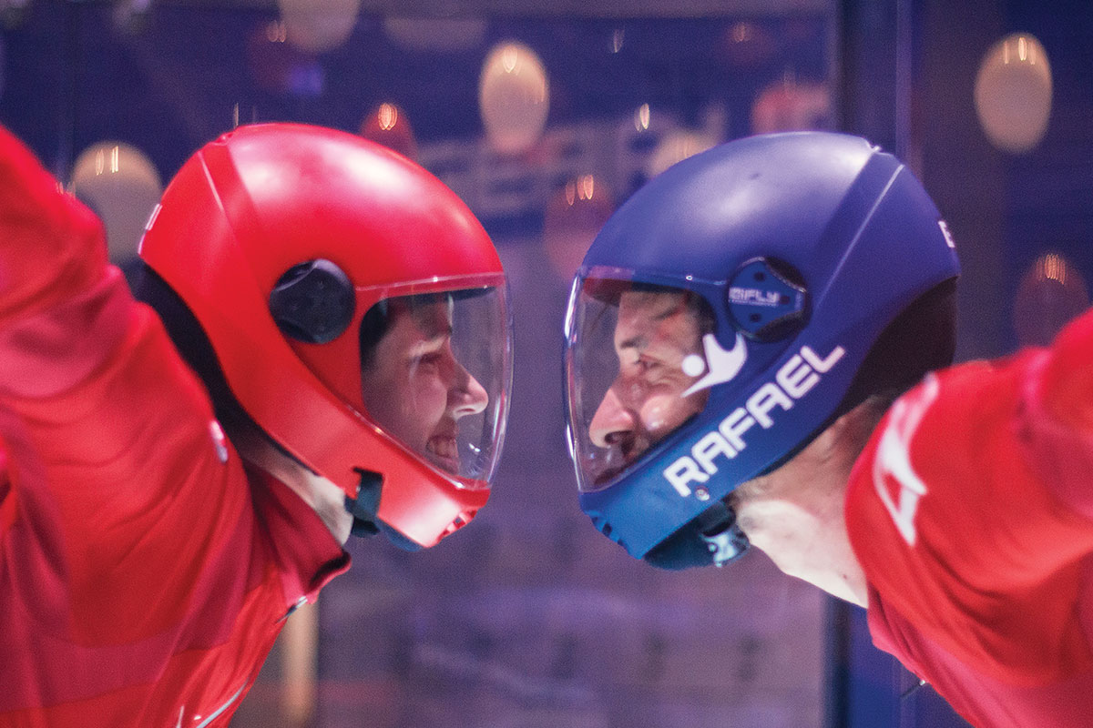 ifly two people facing each other while flying