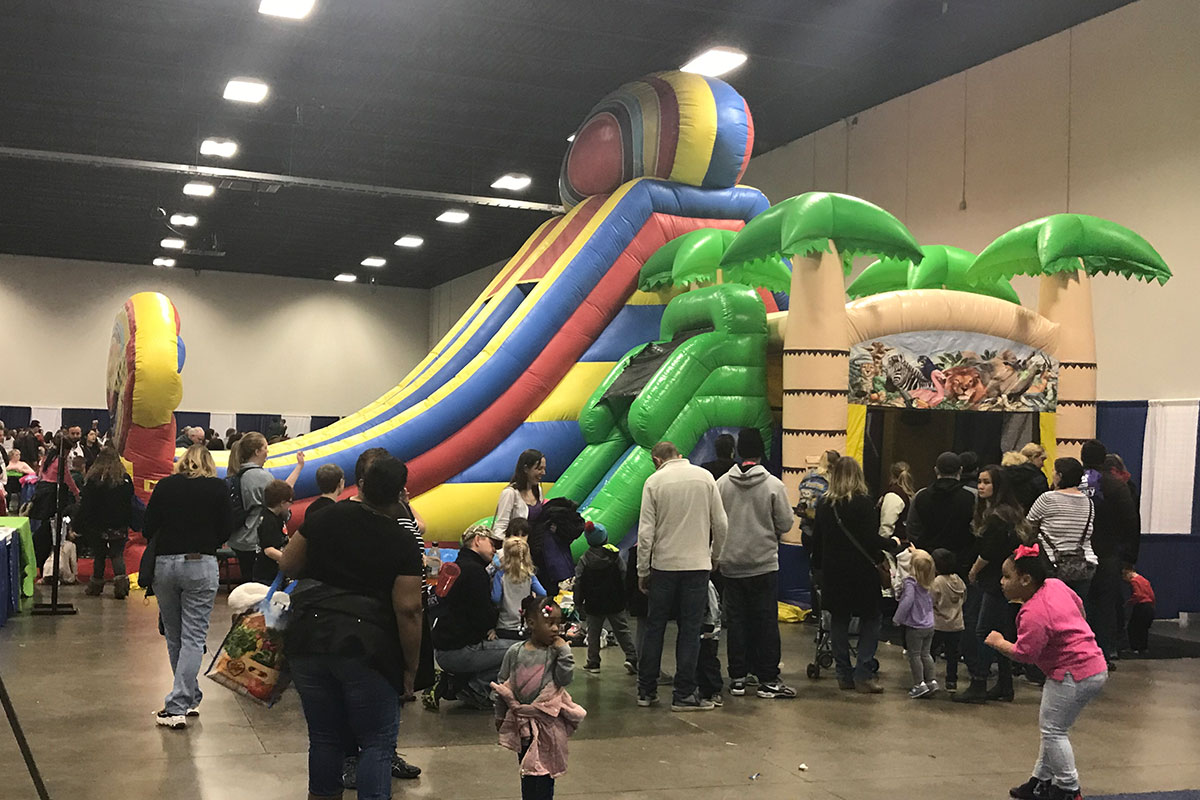 bouncy house with families around it