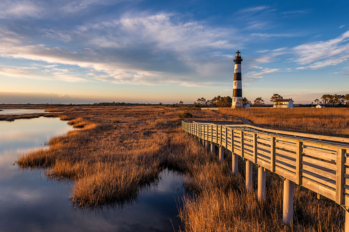 outer banks of north carolina with bridge and lighthouse