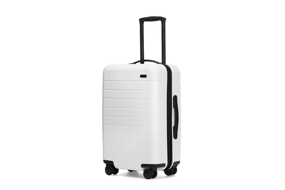 white carry on suitcase by away