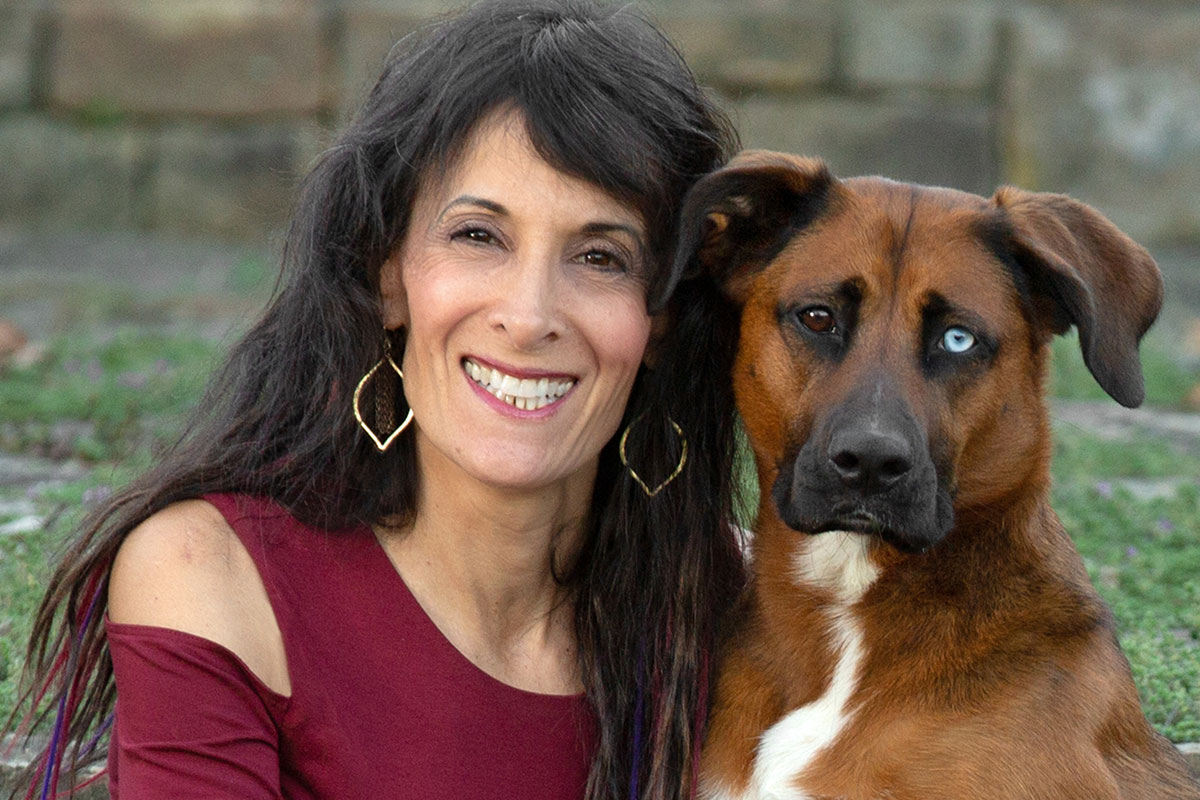 ellen zangla and her dog with two different colored eyes