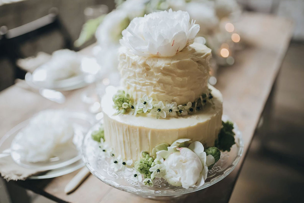 white cake with flower on it