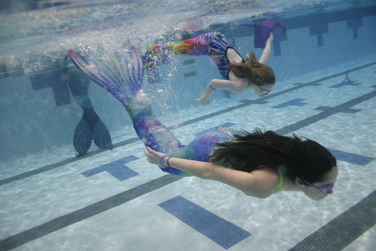 mermaids swimming in pool