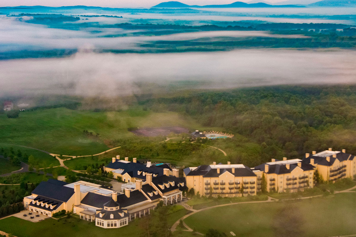 salamander resort and spa with clouds above it, aerial view