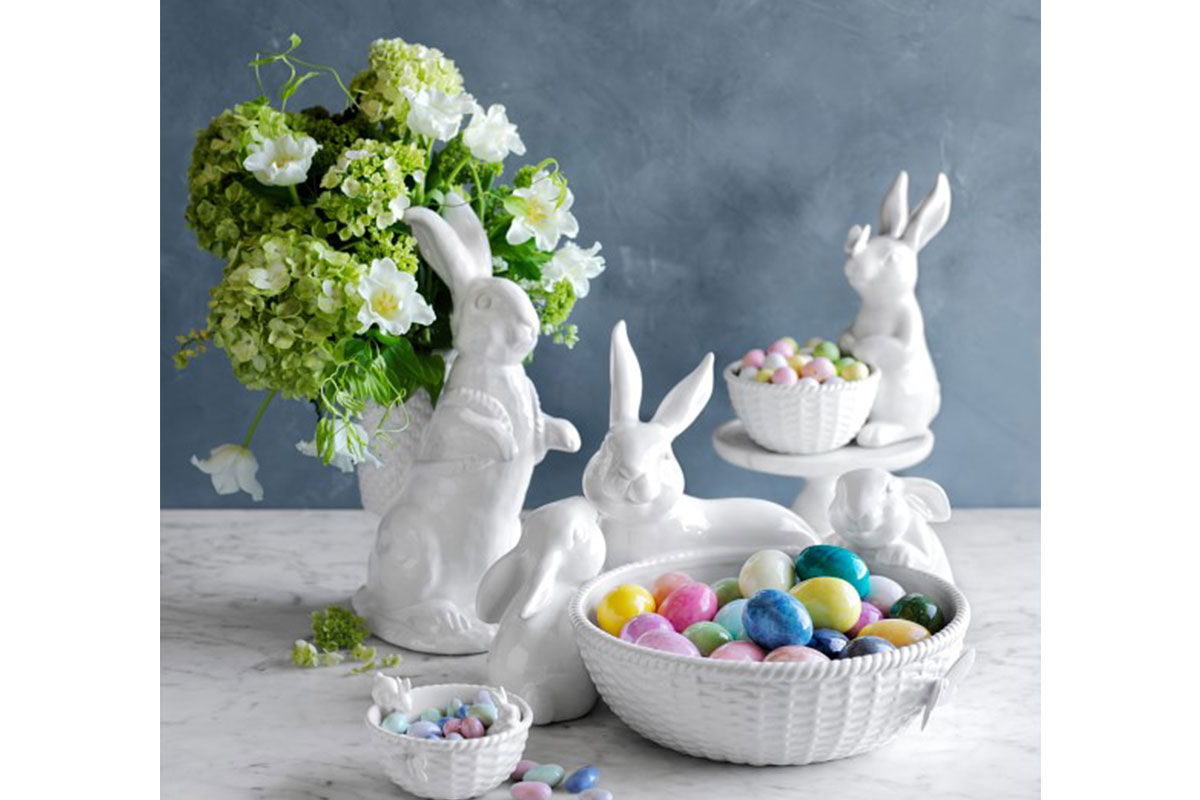 ceramic easter bunny decor with colorful eggs in it