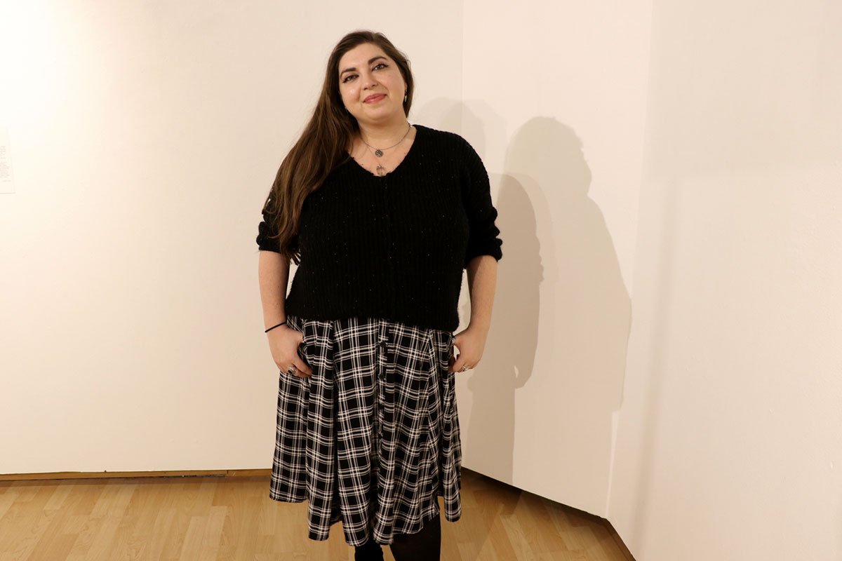 woman in black shirt and checkered skirt