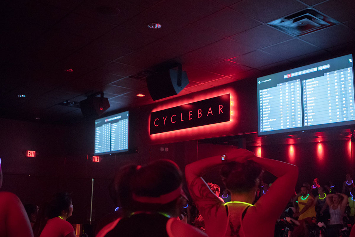 red room with screens and cyclebar sign