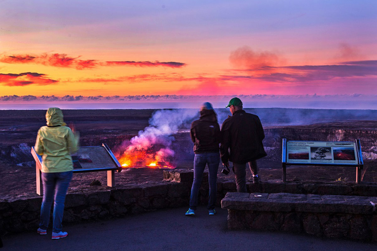 people standing at volcano in Hawaii