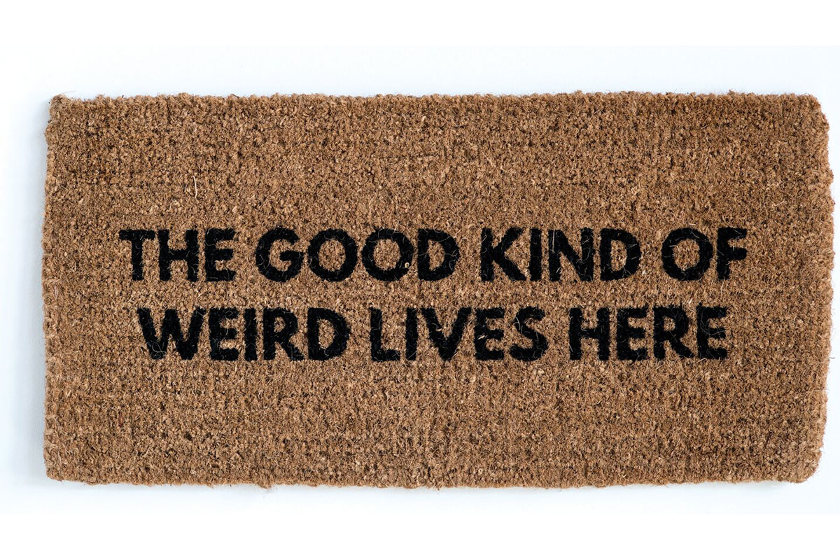 welcome mat that says the good kind of weird lives here