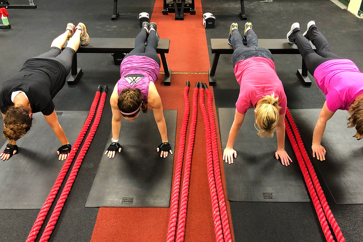 four women doing planks
