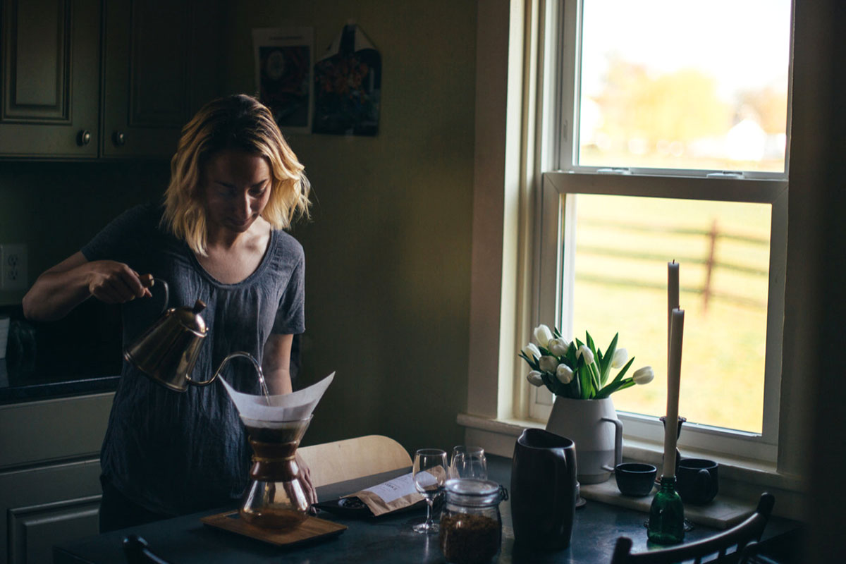 woman pouring coffee in a pour over