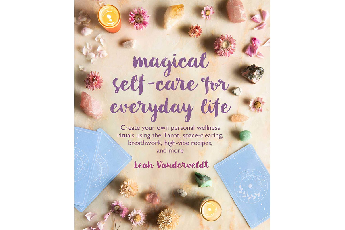 magical self-care for everyday life book cover with flowers and herbs and tarot cards