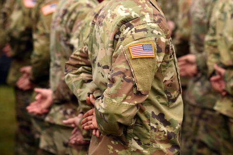 men in army standing at attention