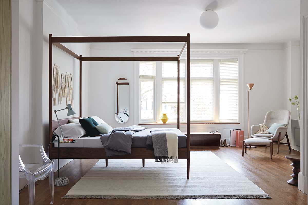design within reach bedroom with minimalist bed frame and white walls