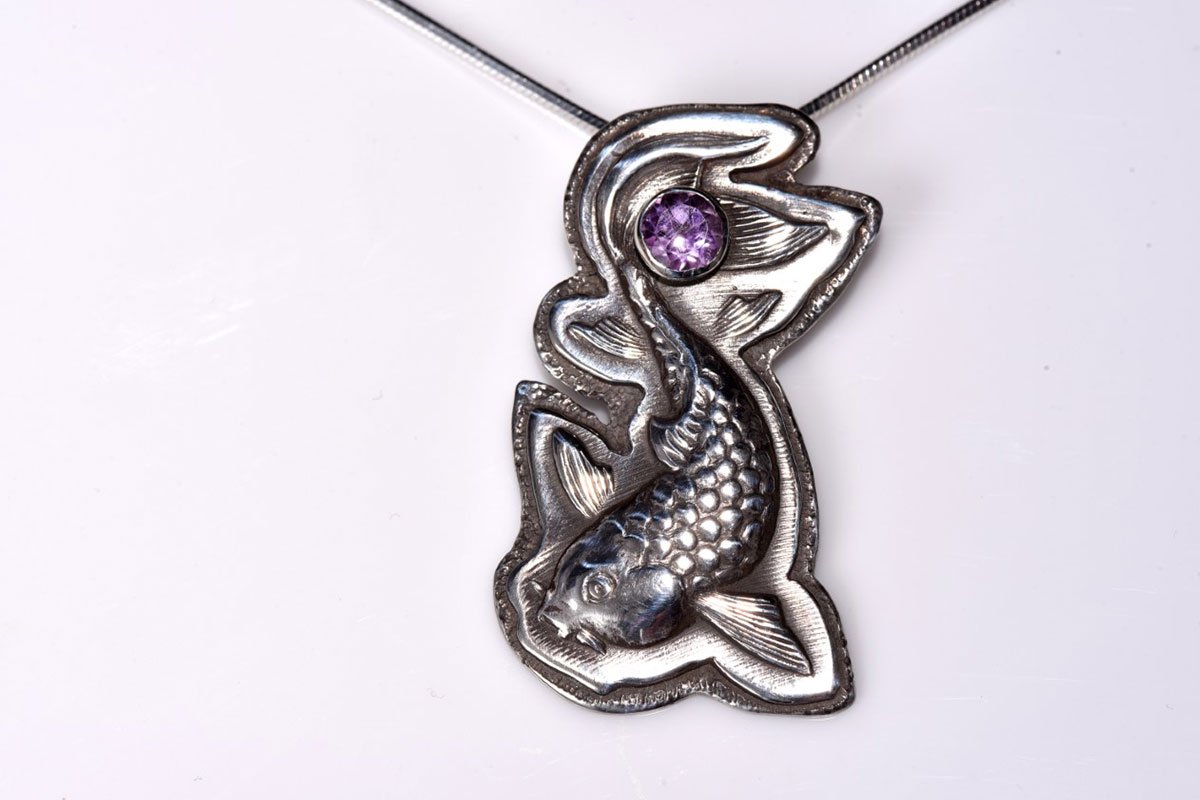 silver necklace of a fish