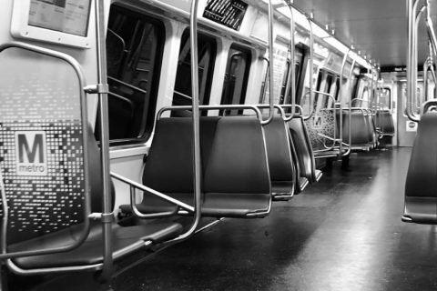 inside of a metro train black and white