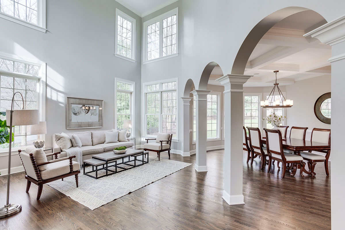 inside of living room with archways and high ceilings
