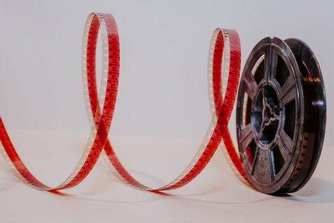 a roll of red film tape