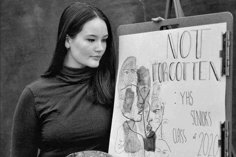 Girl looking at portrait