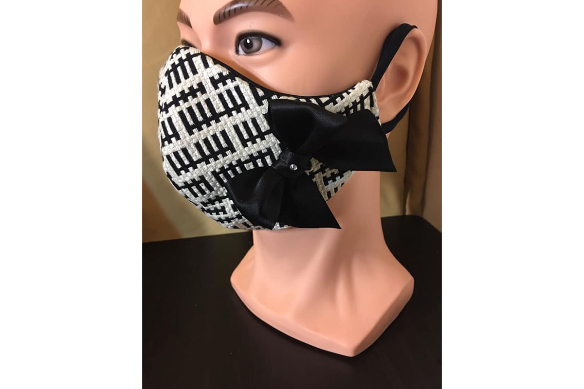 high end face mask with black bow