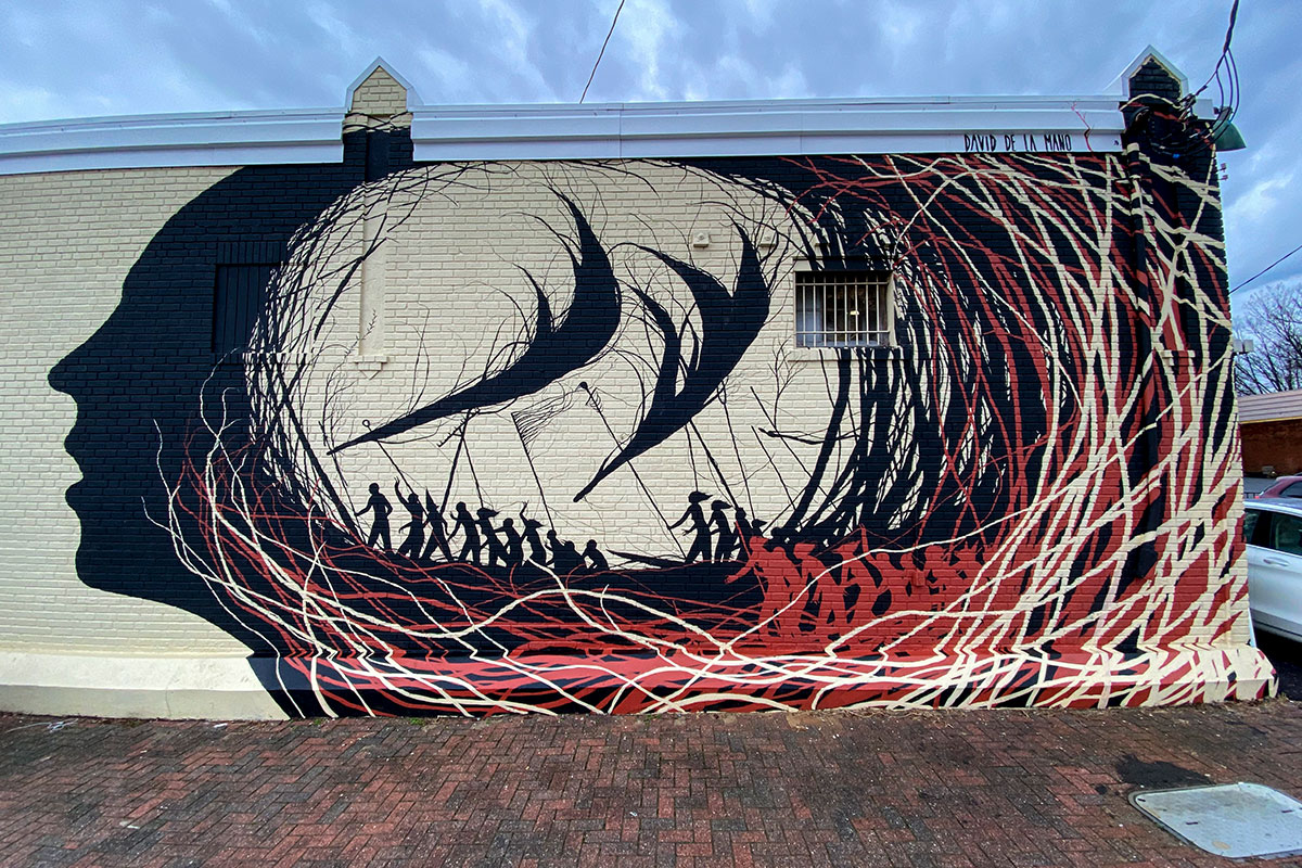 mural in northern virginia with face and black and red lines