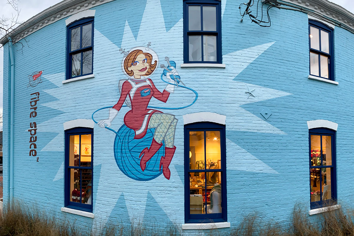 fibre space alexandria blue wall mural with pinup space girl