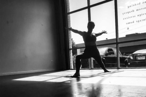 homegrown power yoga warrior two stance black and white