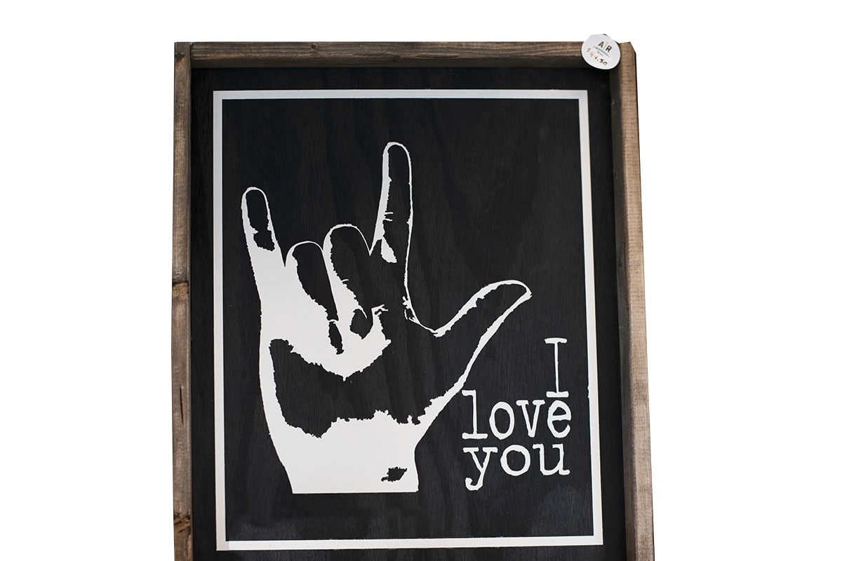 i love you sign with hand sign and black background